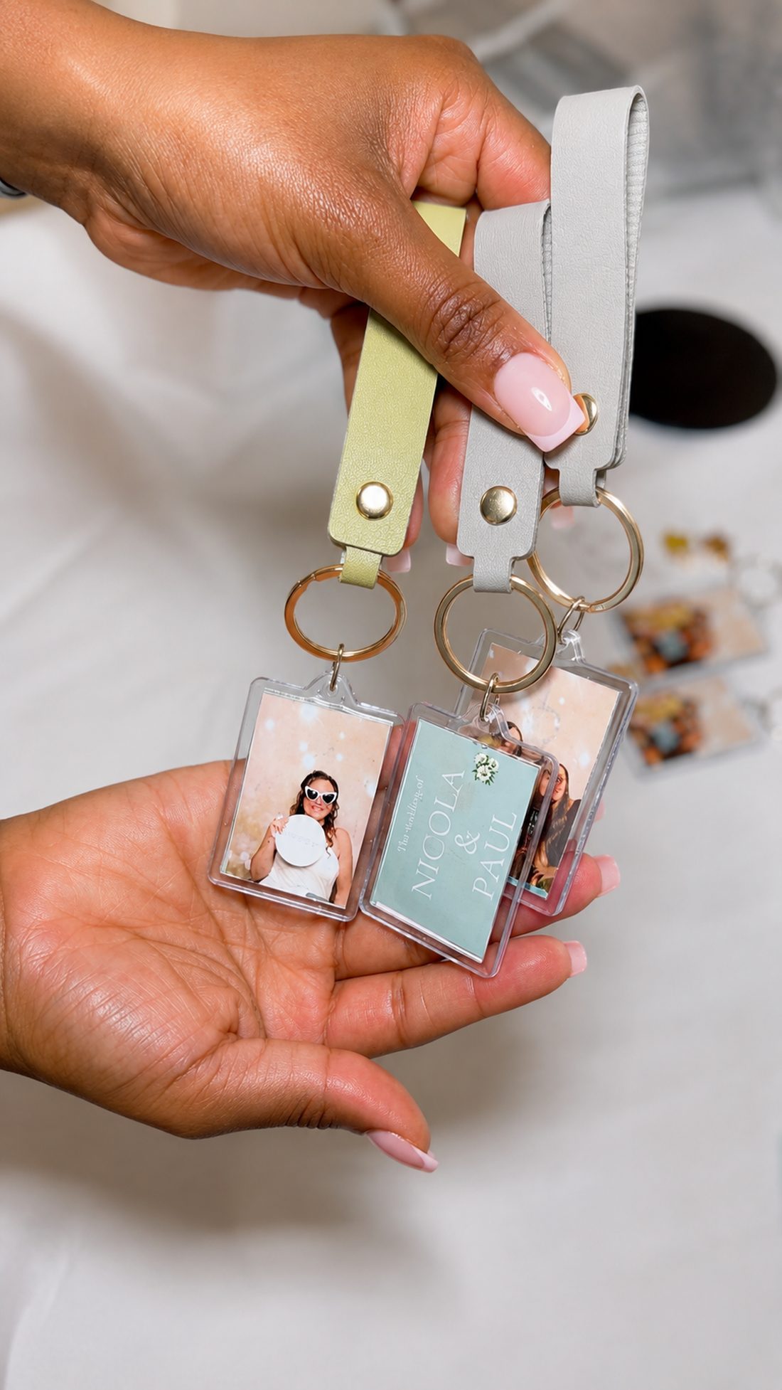 Finished personalised keyrings held in hand at an event